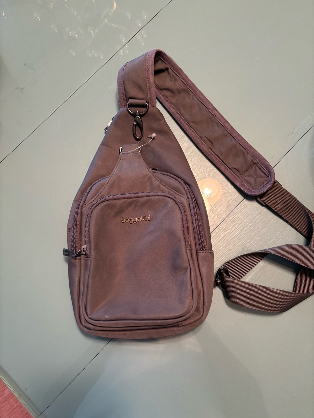 Excellent Baggalini Central Park grey water proof sling crossbody bag